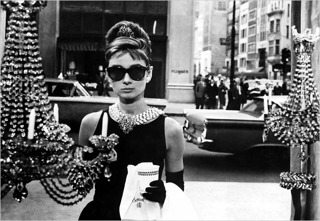 Audrey Hepburn in “Breakfast At Tiffany’s” wearing Ray-Ban Wayfarers